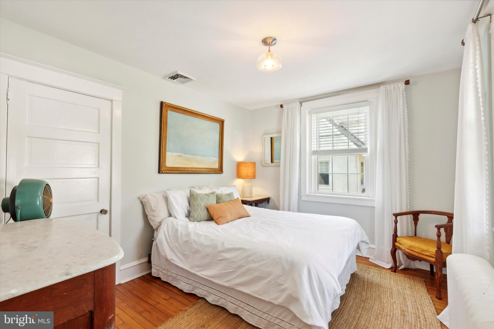 403 Old Lancaster Road Berwyn, PA 19312 - Photo 22 of 41 a bedroom with a bed and wooden floor
