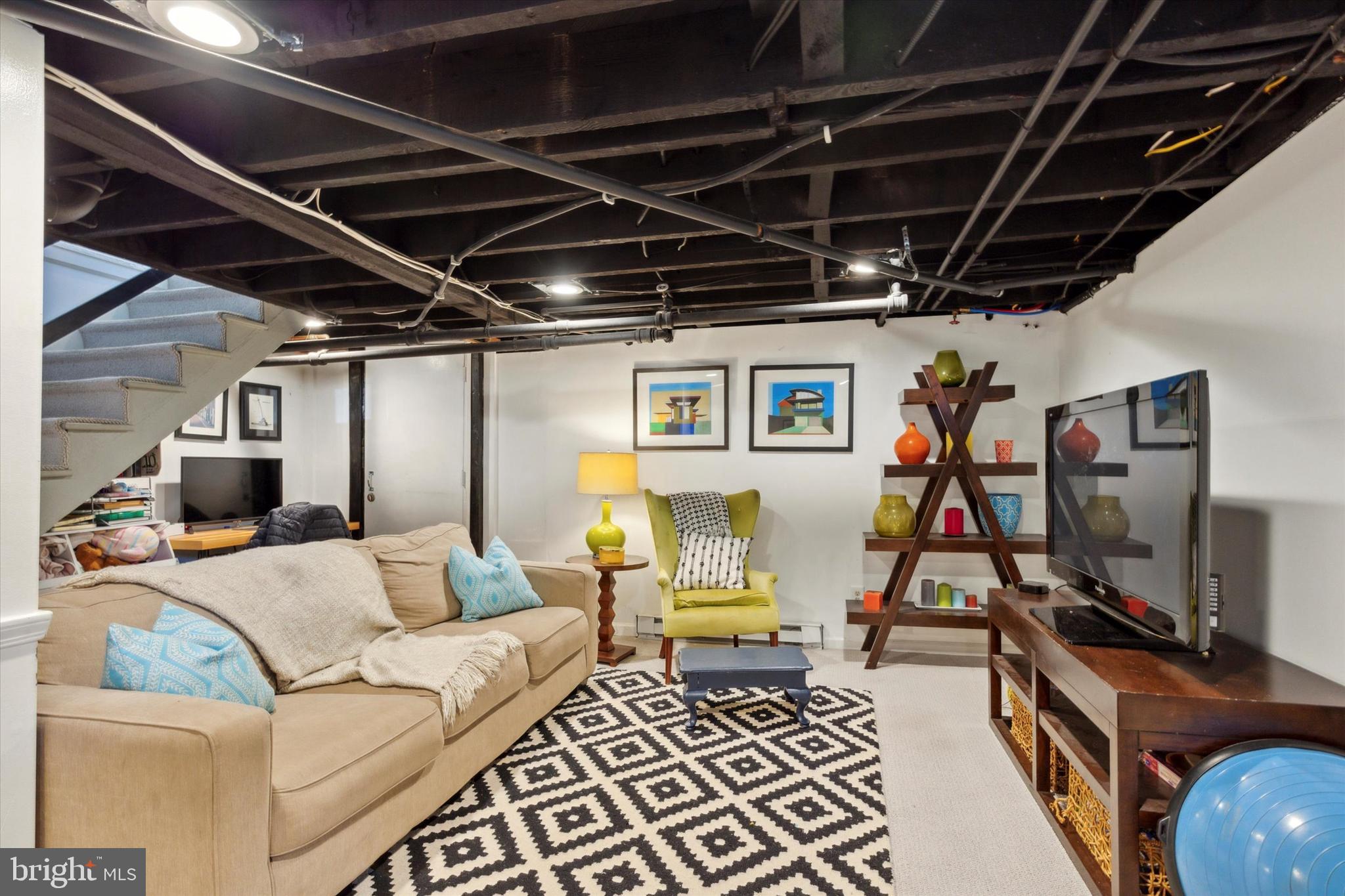 403 Old Lancaster Road Berwyn, PA 19312 - Photo 33 of 41 a living room with furniture and a flat screen tv
