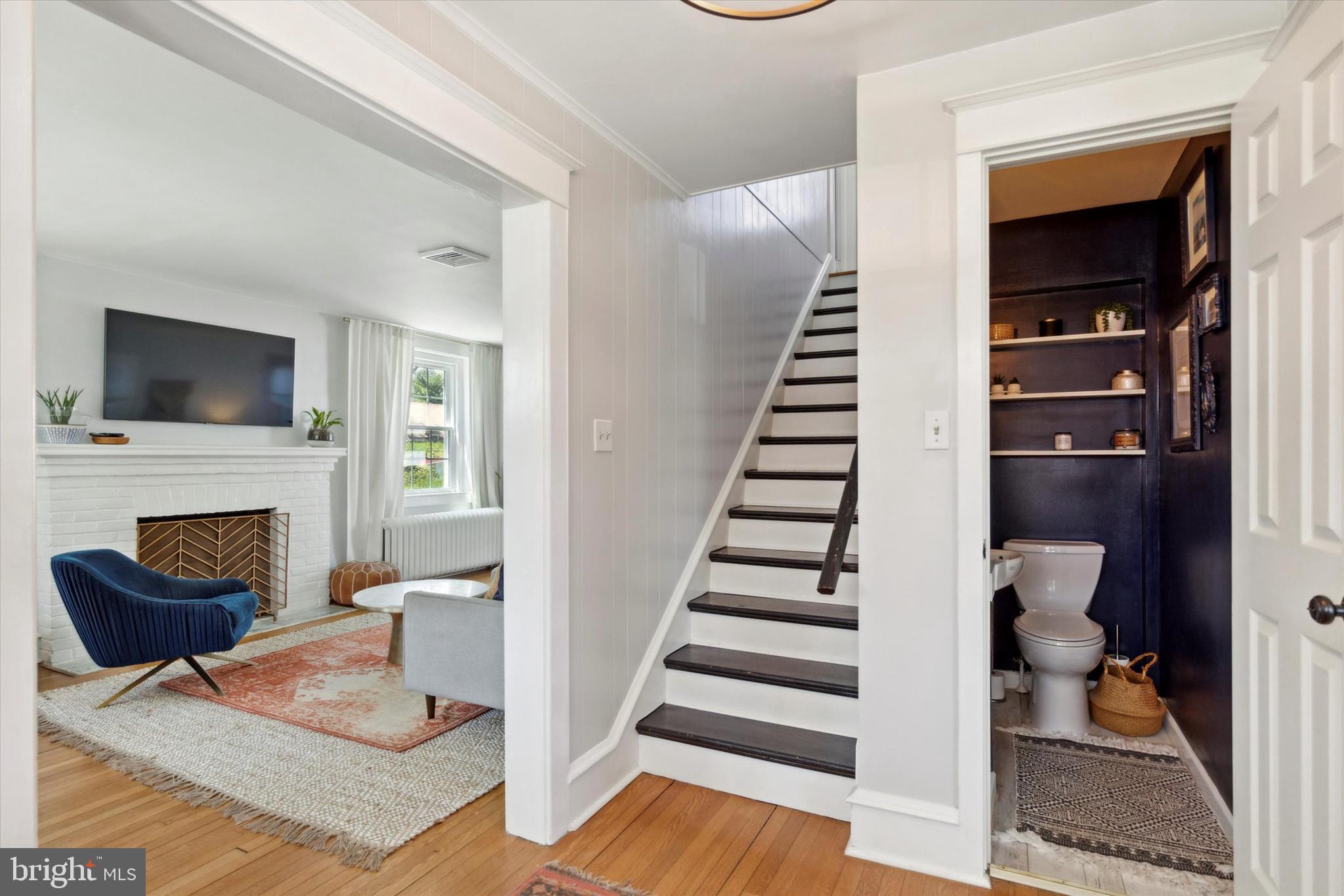 403 Old Lancaster Road Berwyn, PA 19312 - Photo 8 of 41 a living room with furniture and a fireplace