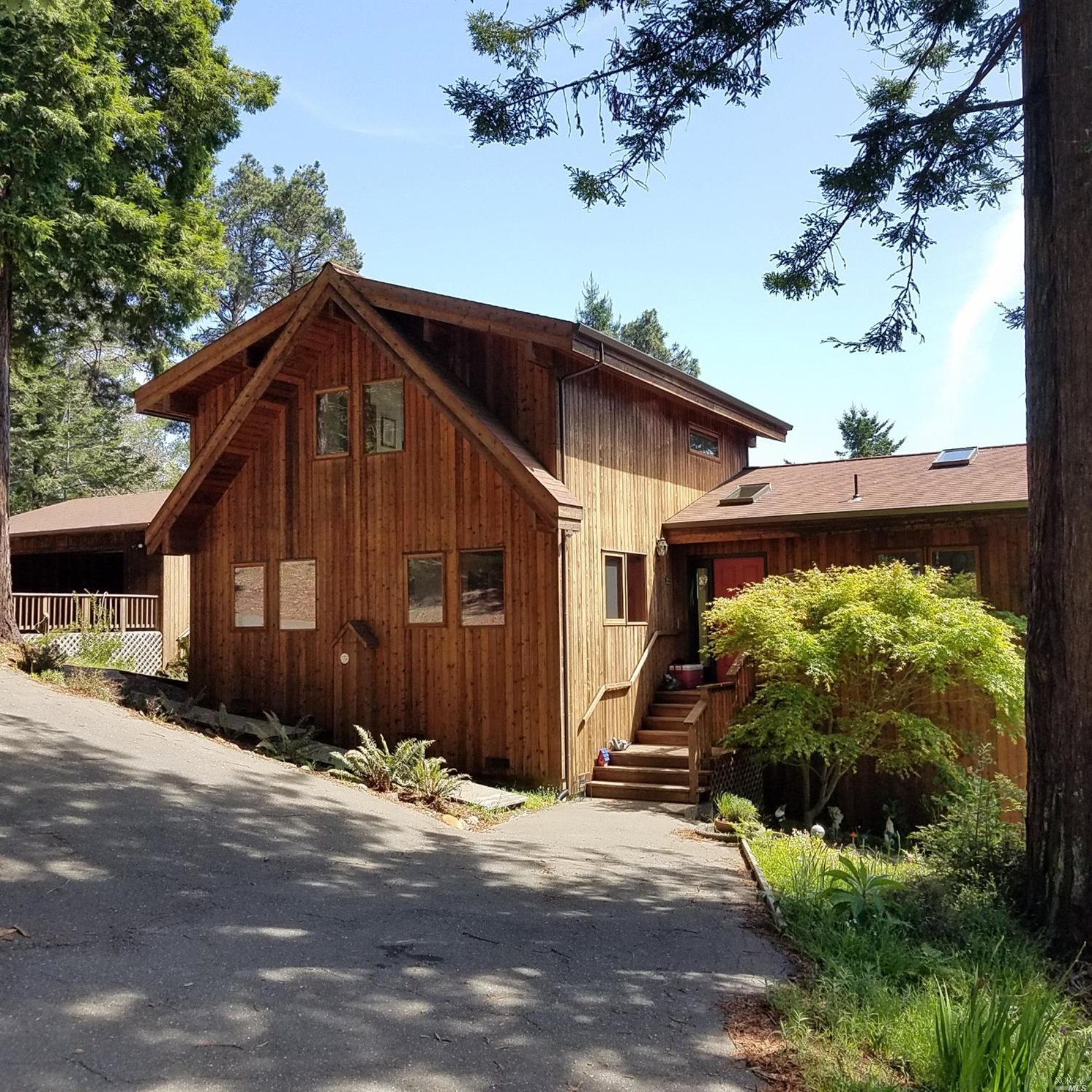 46751 Fish Rock Road Gualala, CA 95445 - Photo 1 of 1 a front view of a house with garden