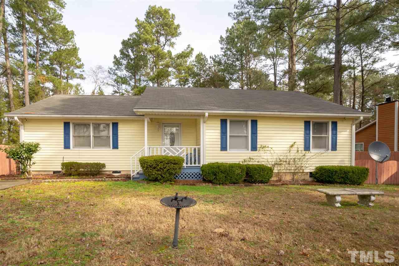 3411 Freeman Road Durham, NC 27703 - Photo 1 of 24 a front view of a house with a garden and patio