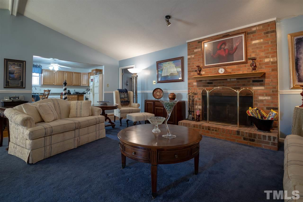 3411 Freeman Road Durham, NC 27703 - Photo 6 of 24 a living room with furniture and a fireplace