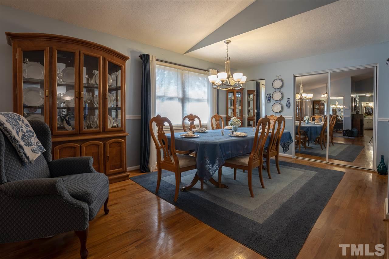 3411 Freeman Road Durham, NC 27703 - Photo 7 of 24 a dining room with furniture and chandelier