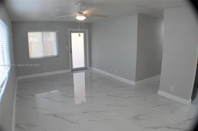 a kitchen with a stove a refrigerator and a sink
