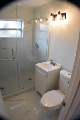 a view of a pathway with a wooden fence