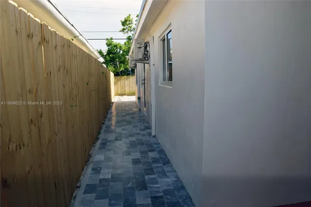 a wooden door in front of house