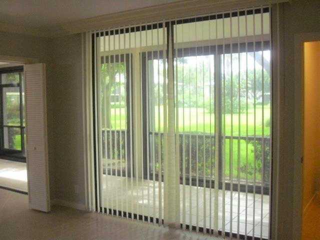 11 Concourse Drive, Unit 11A Tequesta, FL 33469 - Photo 29 of 54 View to Patio from Den/Bdrm 3