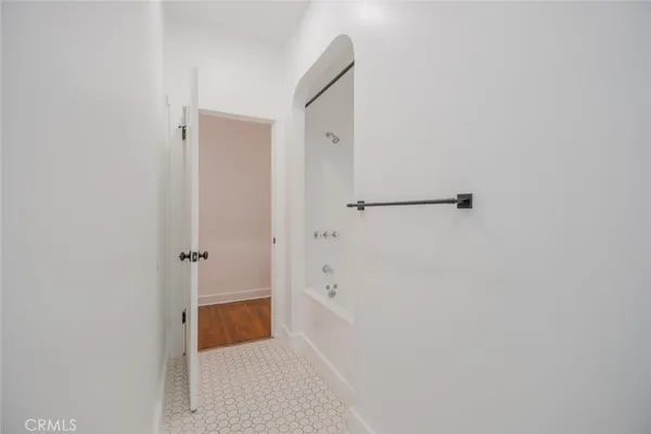 a bathroom with a sink toilet and mirror