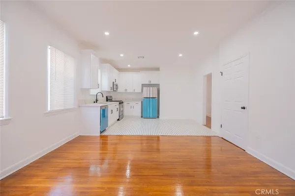 a view of kitchen with wooden floor