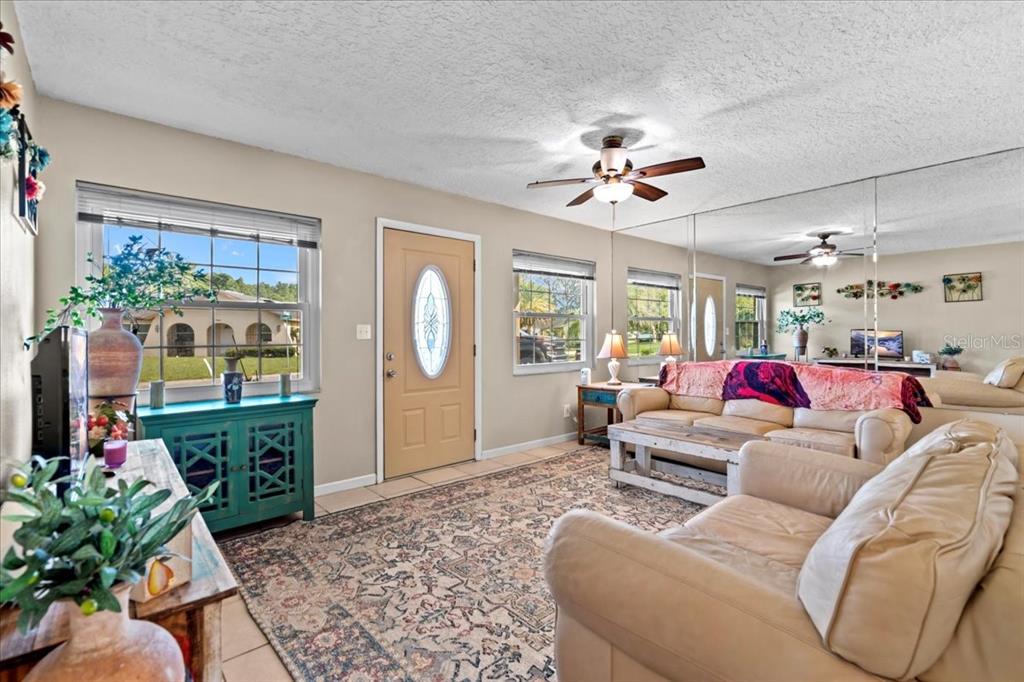 7041 Daggett Terrace New Port Richey, FL 34655 - Photo 12 of 29 a living room with furniture and a fireplace