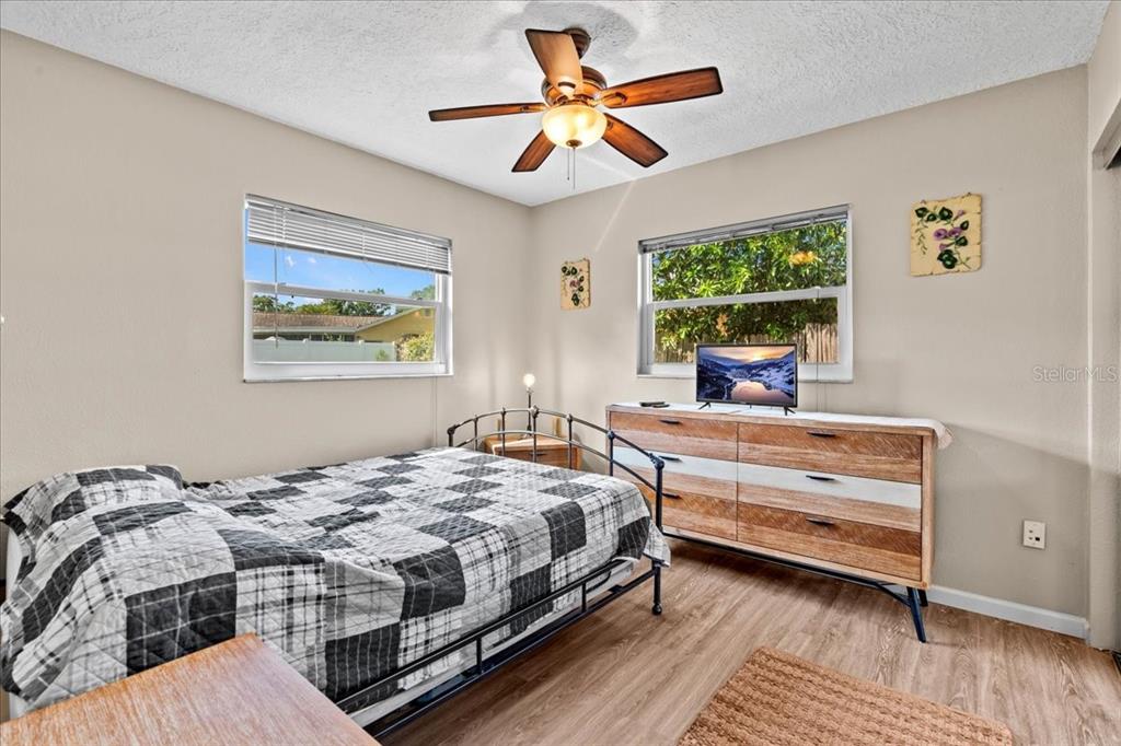 7041 Daggett Terrace New Port Richey, FL 34655 - Photo 17 of 29 a bedroom with a bed and a window