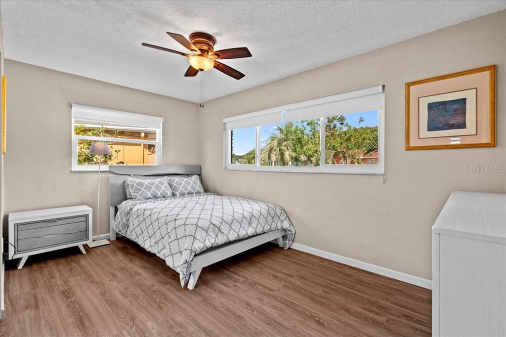 7041 Daggett Terrace New Port Richey, FL 34655 - Photo 20 of 29 a bedroom with a bed and a window