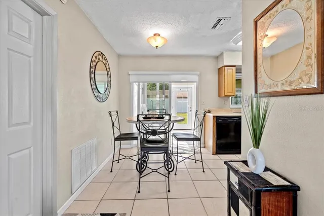a dining room with furniture and a fireplace