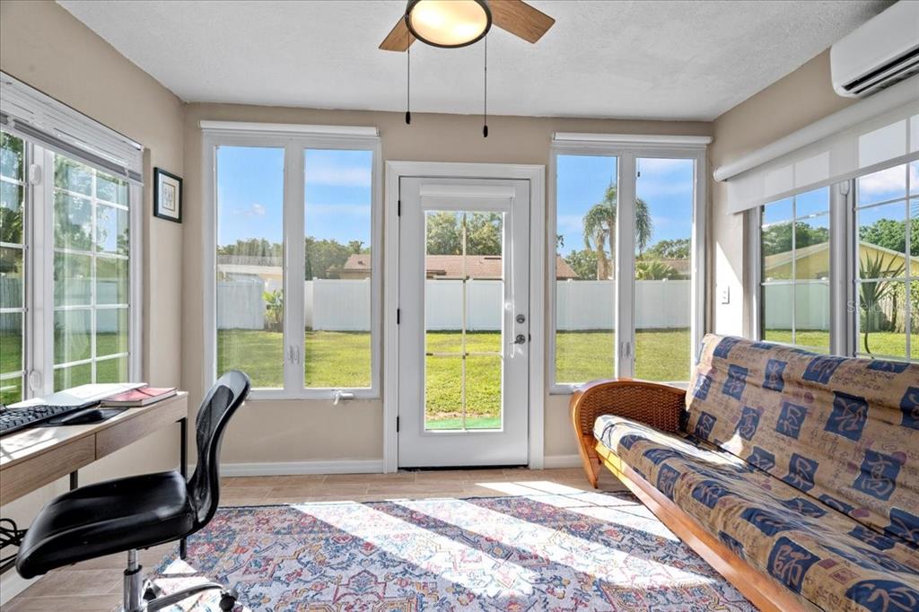 7041 Daggett Terrace New Port Richey, FL 34655 - Photo 24 of 29 a living room with furniture and a large window