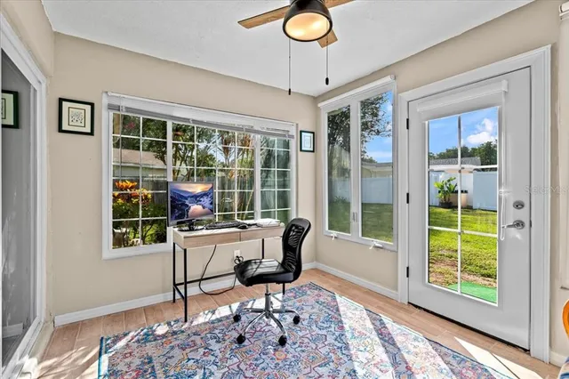 a work room with furniture and a window