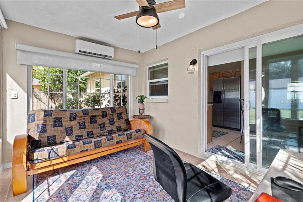 7041 Daggett Terrace New Port Richey, FL 34655 - Photo 26 of 29 a living room with lots of furniture and a table