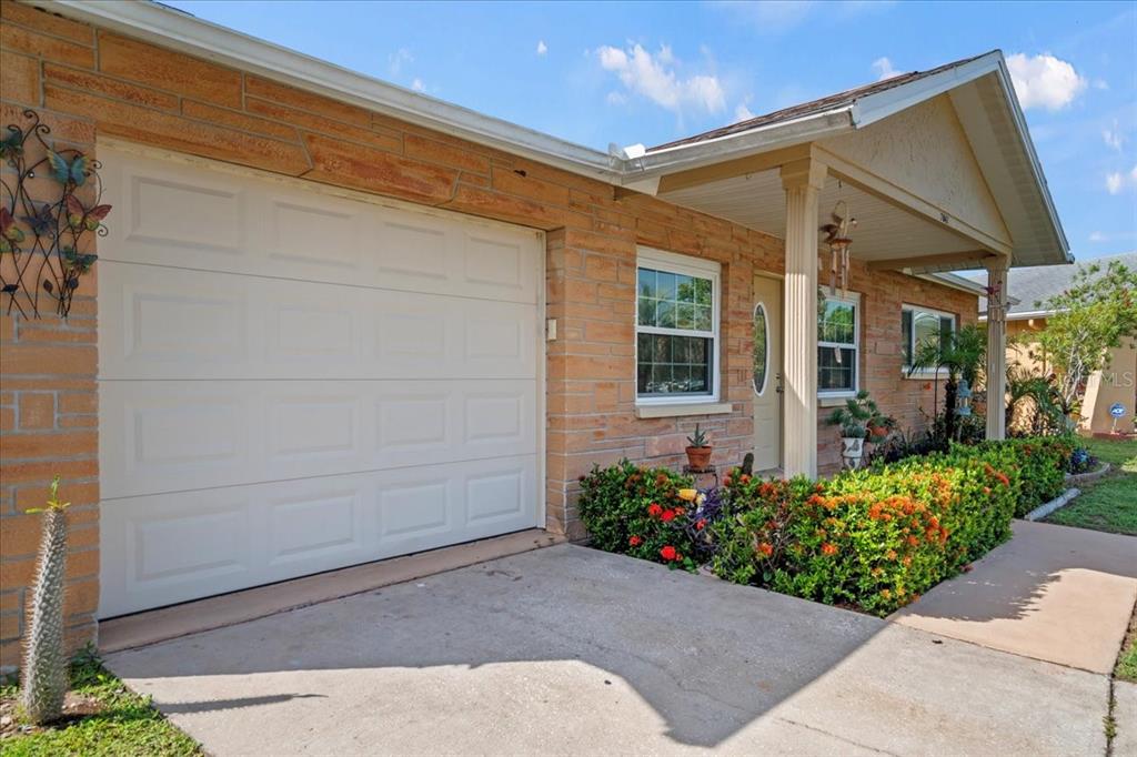 7041 Daggett Terrace New Port Richey, FL 34655 - Photo 5 of 29 a front view of a house having yard