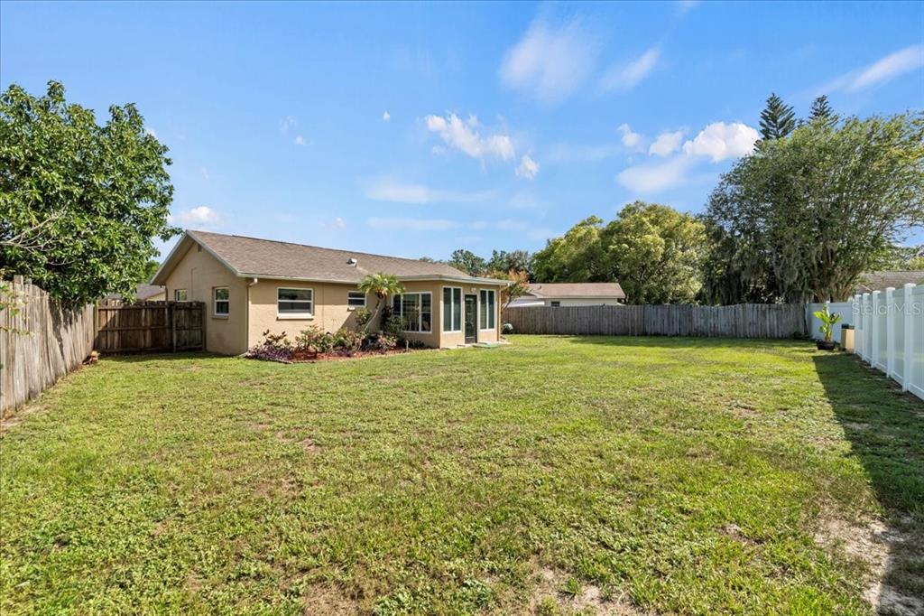 7041 Daggett Terrace New Port Richey, FL 34655 - Photo 8 of 29 a front view of a house with a yard