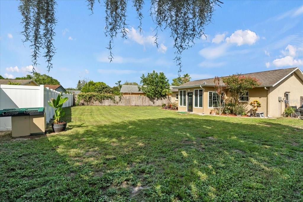 7041 Daggett Terrace New Port Richey, FL 34655 - Photo 9 of 29 a view of a house with a big yard