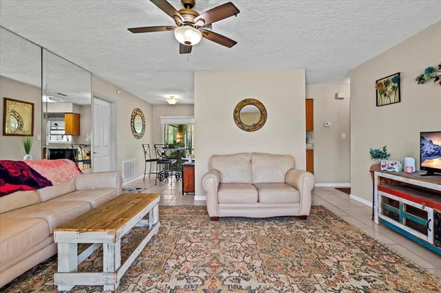 a living room with furniture and a clock