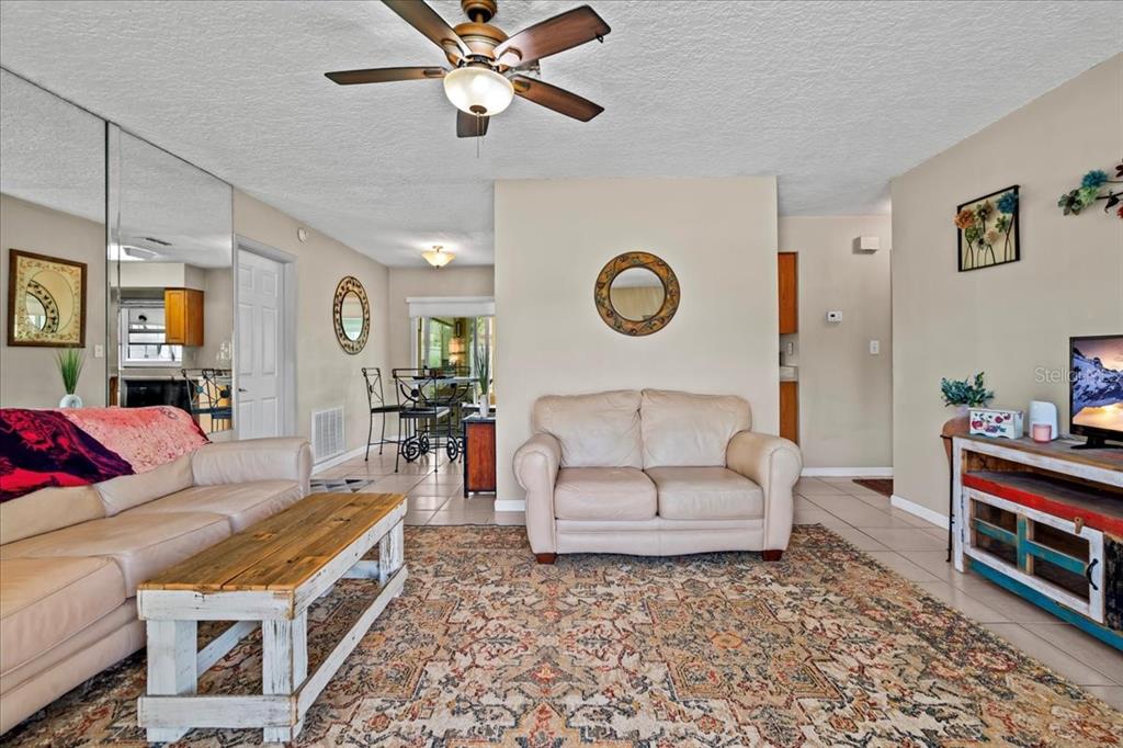 7041 Daggett Terrace New Port Richey, FL 34655 - Photo 10 of 29 a living room with furniture and a clock