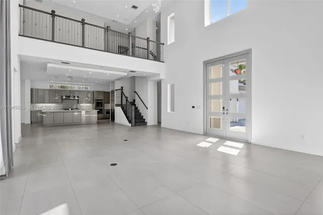 a large kitchen with stainless steel appliances granite countertop a large counter top and a stove