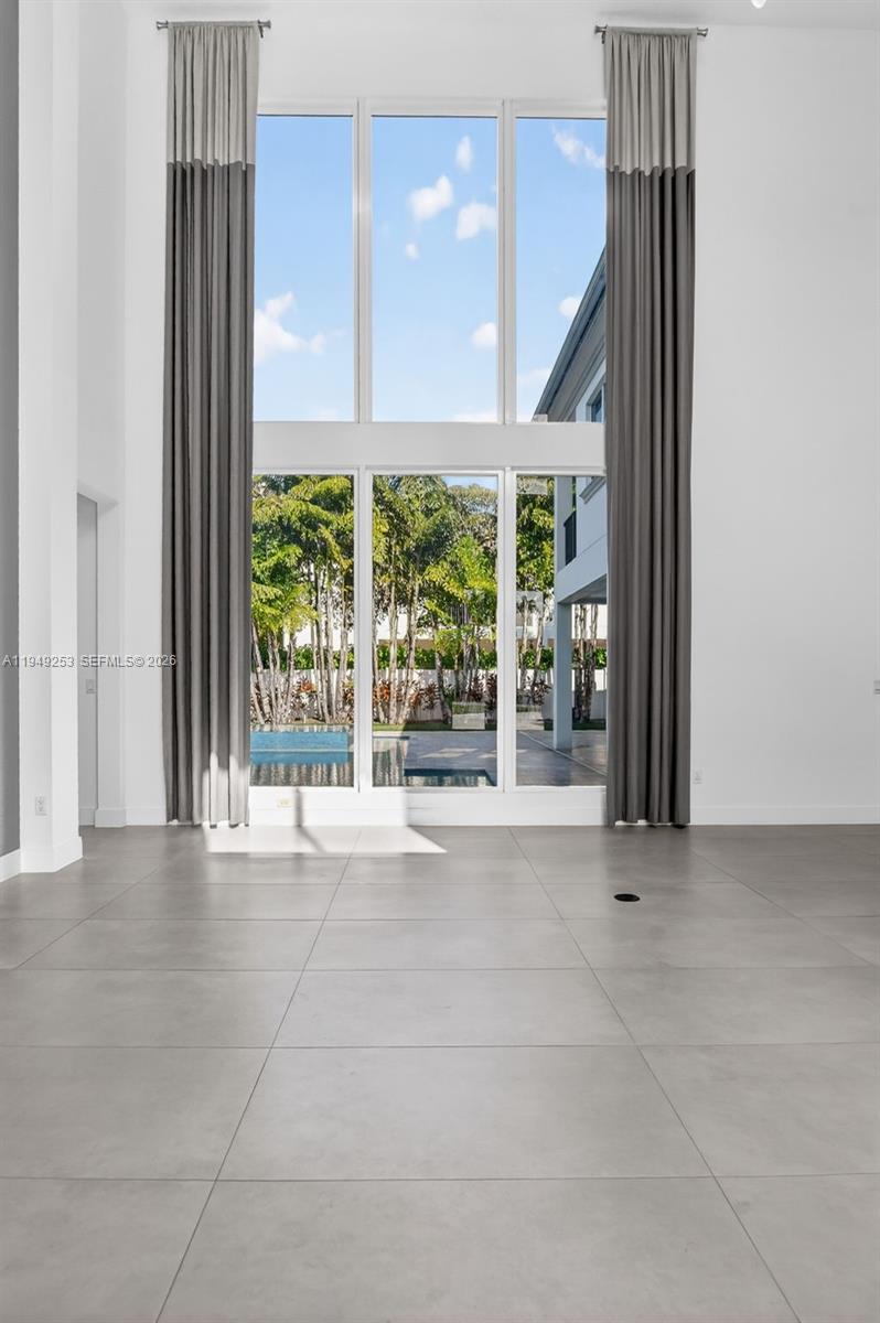 201 Northeast 6th Street Boca Raton, FL 33432 - Photo 15 of 100 a view of an empty room with wooden floor and a window