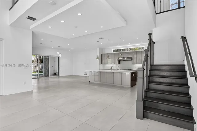 a view of an empty room with glass door and closet