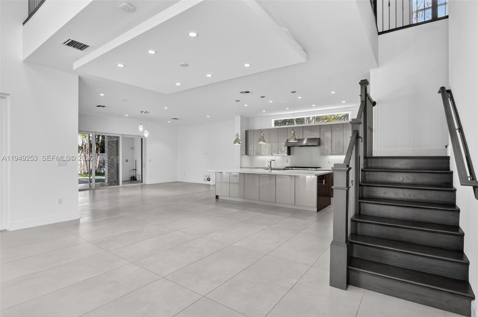 201 Northeast 6th Street Boca Raton, FL 33432 - Photo 16 of 100 a view of a hallway with stairs and a furniture