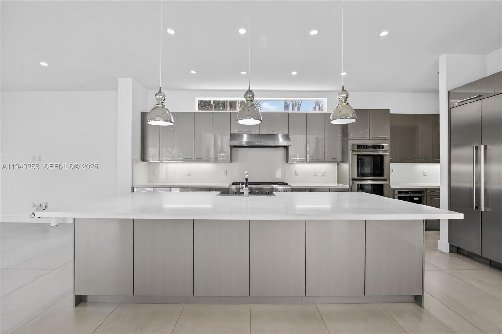 201 Northeast 6th Street Boca Raton, FL 33432 - Photo 18 of 100 a large kitchen with stainless steel appliances kitchen island granite countertop a sink and cabinets
