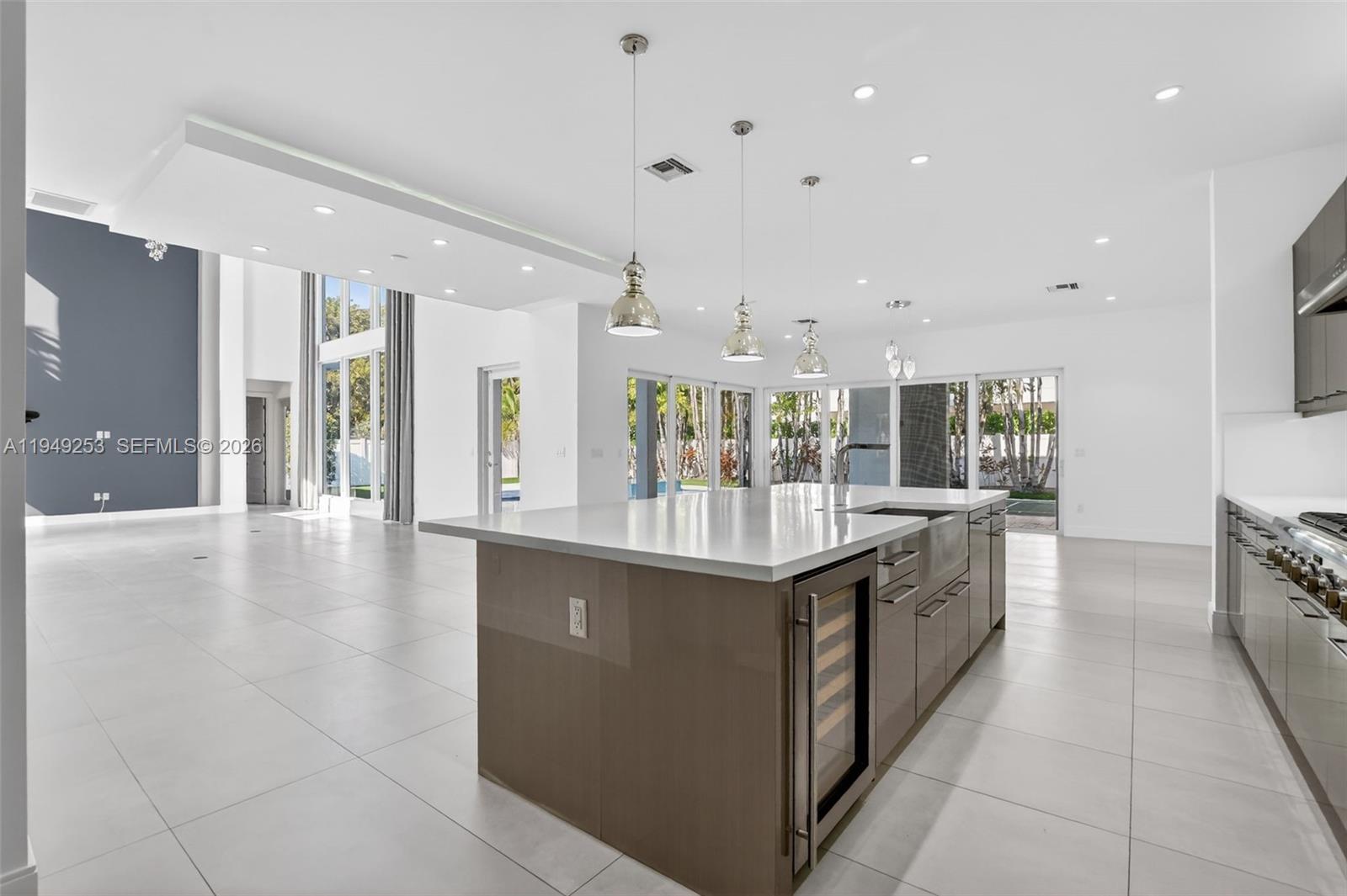 201 Northeast 6th Street Boca Raton, FL 33432 - Photo 22 of 100 a large kitchen with stainless steel appliances granite countertop a large counter top and a stove