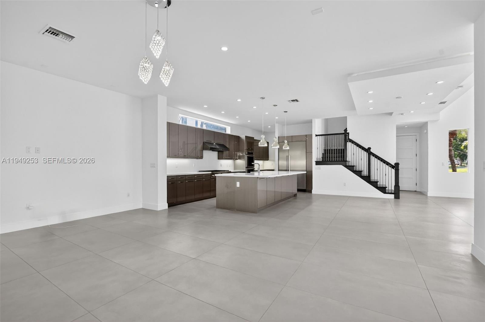 201 Northeast 6th Street Boca Raton, FL 33432 - Photo 26 of 100 a view of a kitchen with a sink and white cabinets