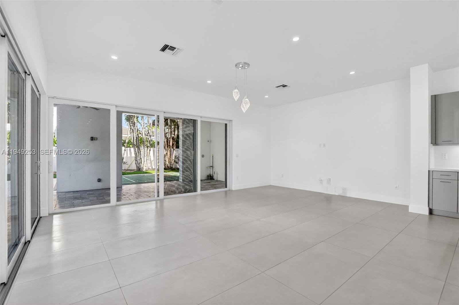 201 Northeast 6th Street Boca Raton, FL 33432 - Photo 27 of 100 a view of an empty room with glass door and closet