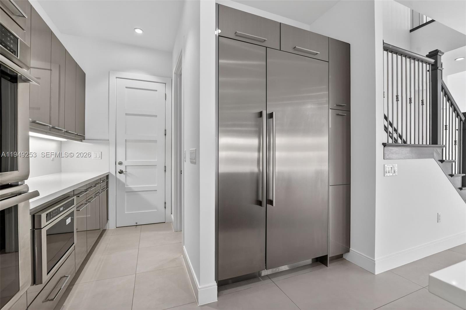 201 Northeast 6th Street Boca Raton, FL 33432 - Photo 36 of 100 a kitchen with a refrigerator and a sink