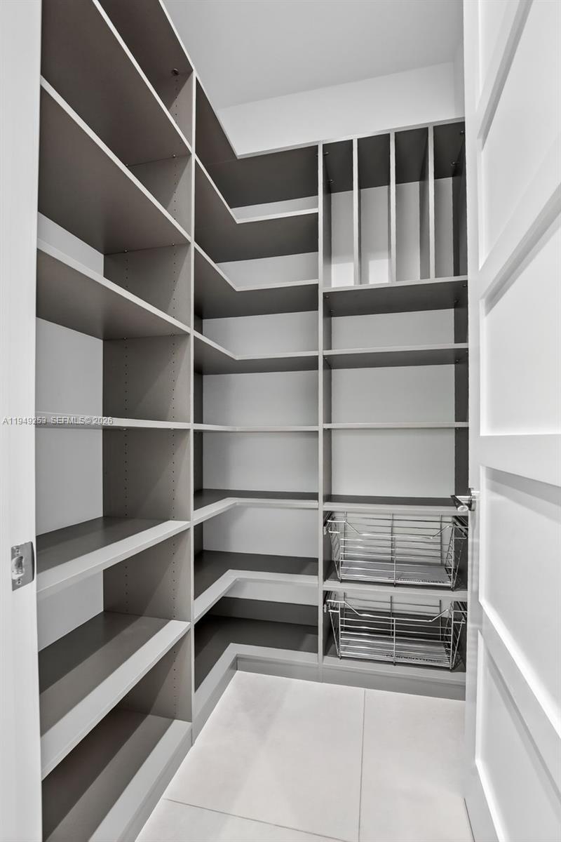 201 Northeast 6th Street Boca Raton, FL 33432 - Photo 37 of 100 a view of walk in closet with empty racks