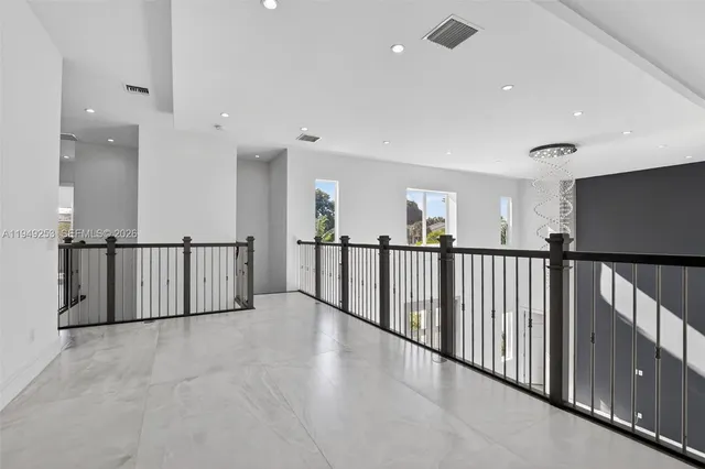 a view of a garden with a house in the background