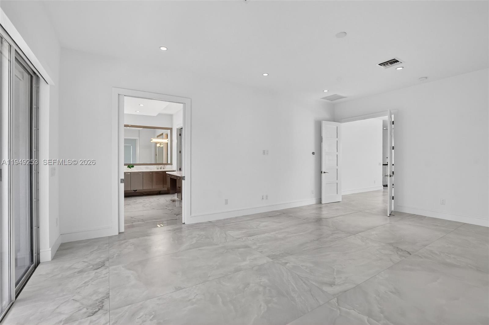 201 Northeast 6th Street Boca Raton, FL 33432 - Photo 6 of 100 a view of an empty room and a bathroom