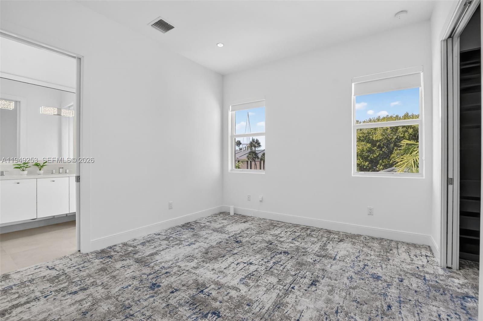 201 Northeast 6th Street Boca Raton, FL 33432 - Photo 70 of 100 wooden floor in an empty room and a window