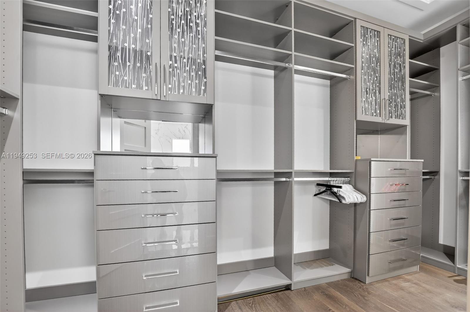 201 Northeast 6th Street Boca Raton, FL 33432 - Photo 7 of 100 a view of walk in closet with empty racks