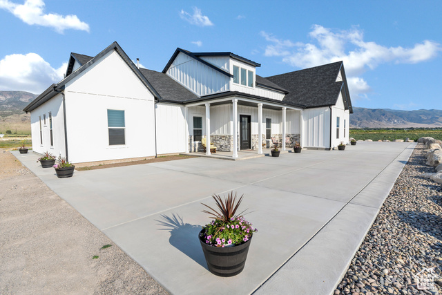 1952 Highway 118 Monroe, UT 84754 - Photo 8 of 88 Back of property with a mountain view, covered porch, board and batten siding, and roof with shingles