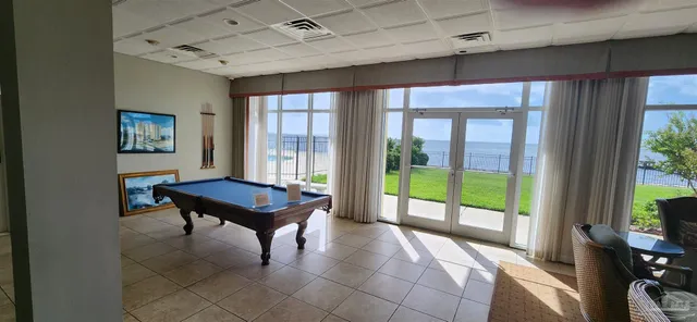 a hallway with a door and couch