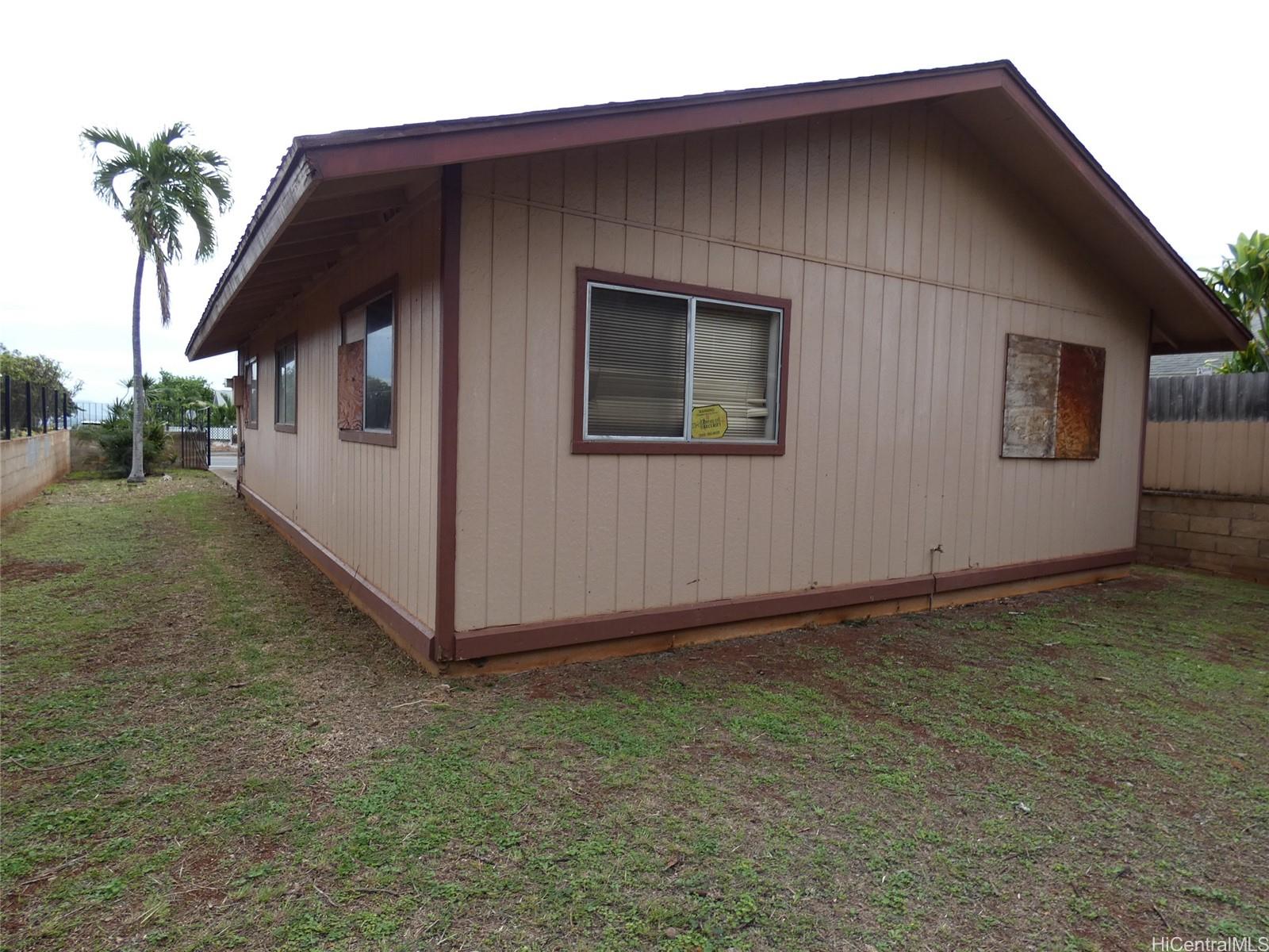 94-605 Kupuna Loop Waipahu, HI 96797 - Photo 12 of 12 a front view of a house with garage