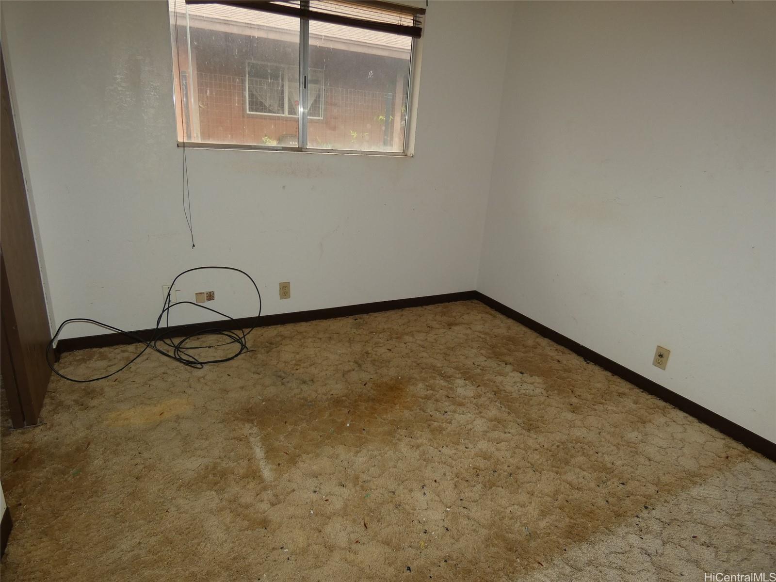 94-605 Kupuna Loop Waipahu, HI 96797 - Photo 4 of 12 an empty room with a bench