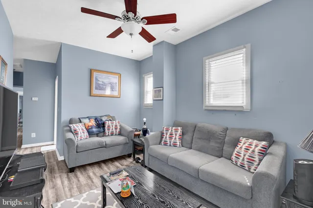 a living room with lots of furniture and gym equipment