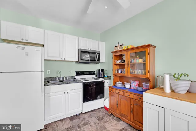 a bedroom with bed and a window