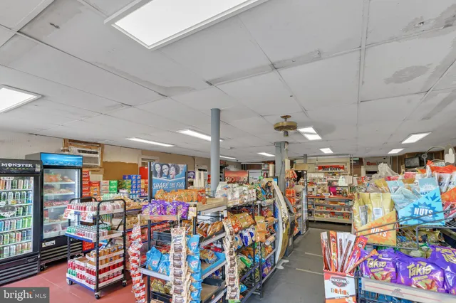 a view of kitchen with furniture and wooden floor