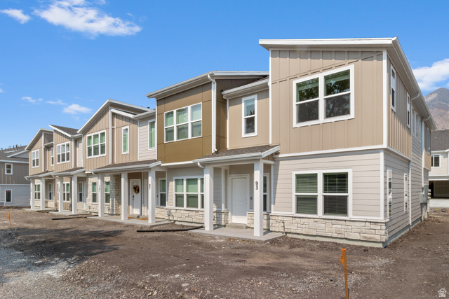 3003 South 265th Street West, Unit 751 Logan, UT 84321 - Photo 1 of 29 View of front of home featuring stone siding, board and batten siding, and a residential view