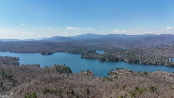 a view of a lake with mountain in the background