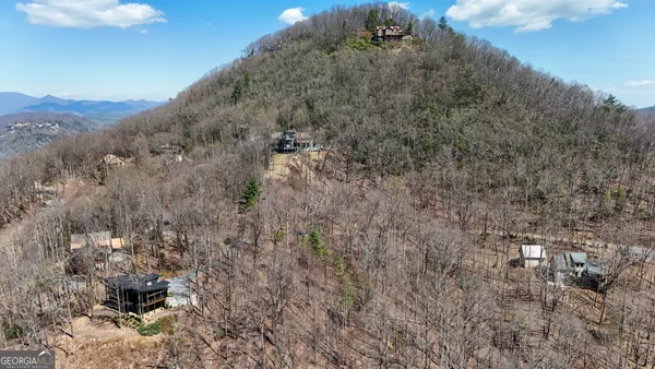 a view of a lake with mountain in the background