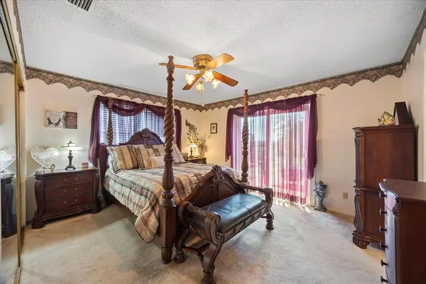 a bed room with a bed and a television